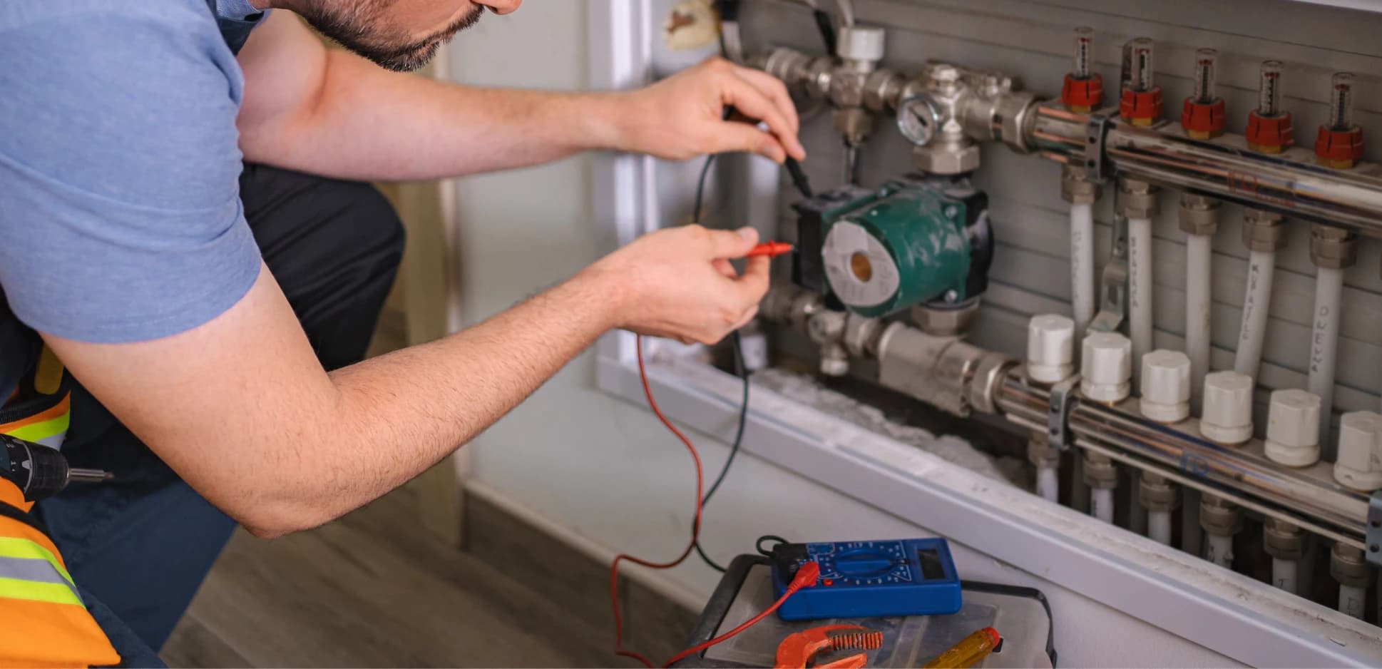Technician inspecting the electrical panel of an air conditioning unit